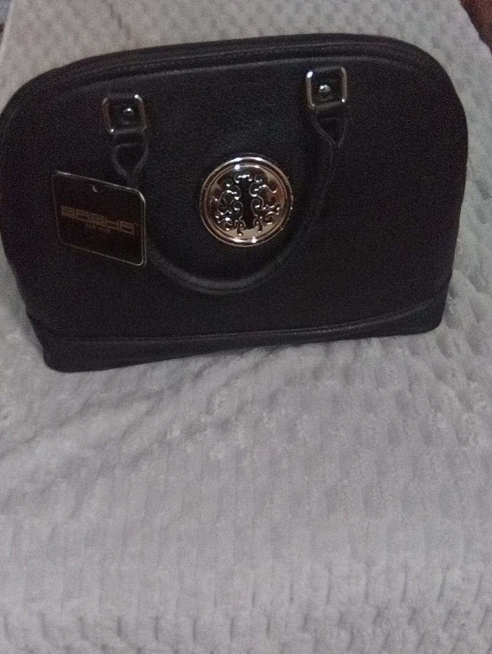 Elegant Black Women's Satchel with Decorative Medallion